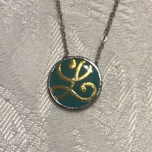 Silver necklace with gold L with teal